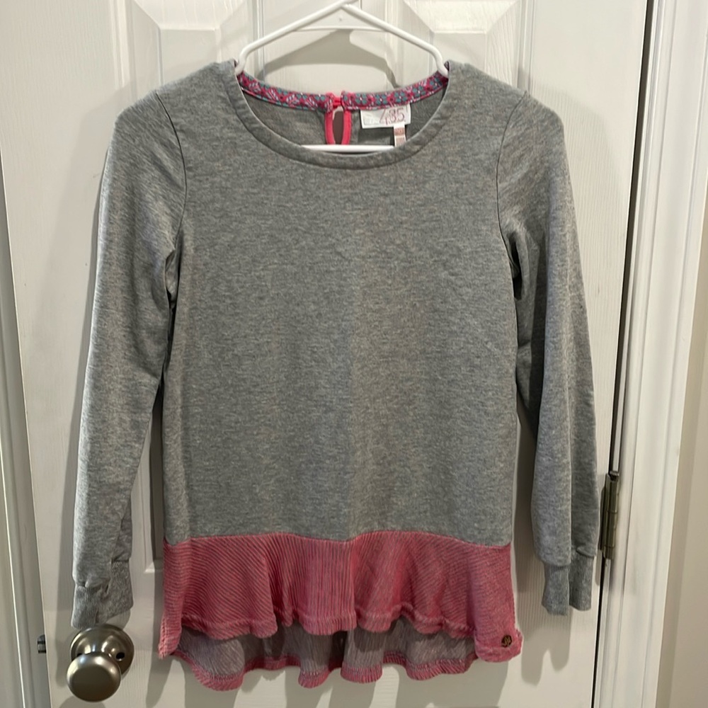 Matilda Jane gray sweatshirt with pink ruffles. Size 10. It was never worn.